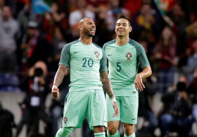 Portugal's Ricardo Quaresma (20) celebrates his goal against Norway with his teammate Raphael Guerreiro after scoring against Norway on Sunday