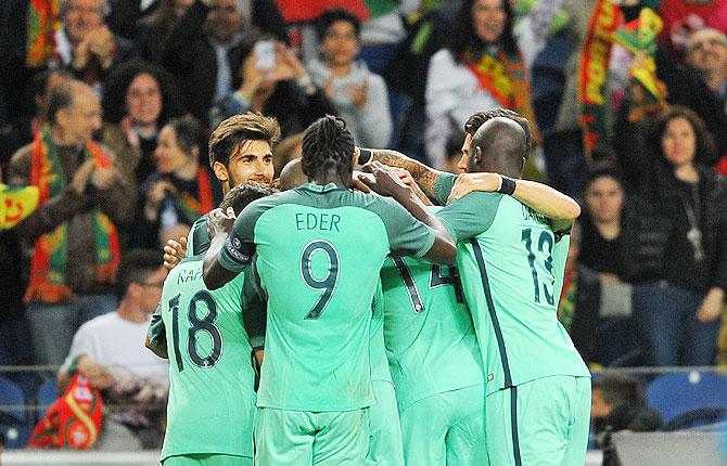 Portugal players celebrate a goal against Norway during their international friendly at Dragao Stadium in Porto, Portugal, on Sunday