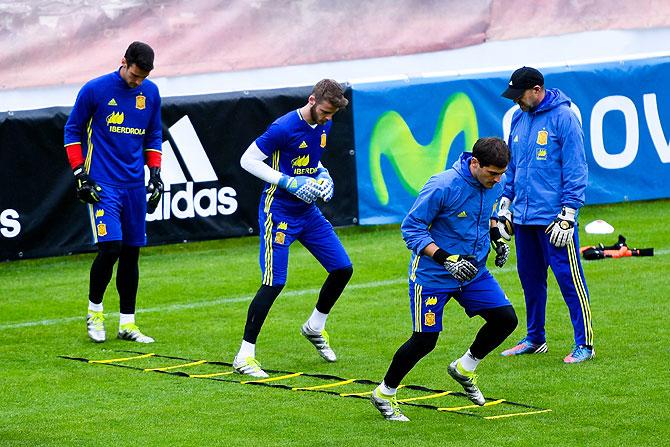 Spain's goalkeepers Sergio Rico, David de Gea and Iker Casillas go through the grind during a training session