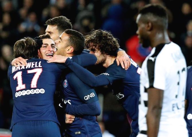 Paris St Germain's Marco Verratti (2nd from left) celebrates with teammates after scoring against Rennais during their Ligue 1 match at Parc de Princes stadium in Paris on Sunday