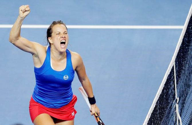 Czech Republic's Barbora Strycova celebrates her victory against France's Alize Cornet in the Fed Cup final in Strasbourg, France, on Sunday