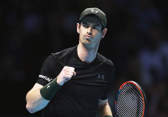 Great Britain's Andy Murray celebrates winning the first set in his men's singles match against Switzerland's Stan Wawrinka on day six of the ATP World Tour Finals at O2 Arena in London on Friday