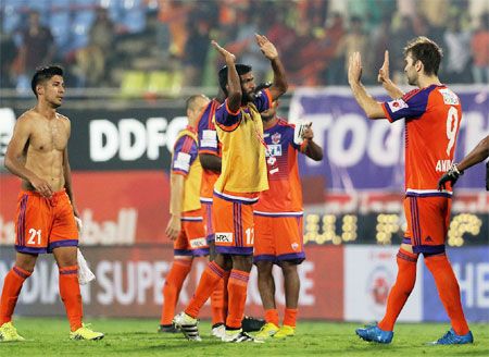 Pune FC players celebrate after defeating Delhi Dynamos in Pune on Friday