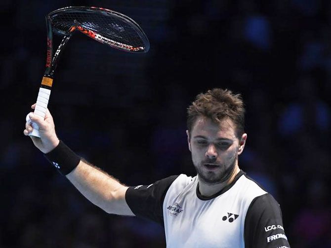 Stanislas Wawrinka with a broken racquet during his round robin match against Andy Murray