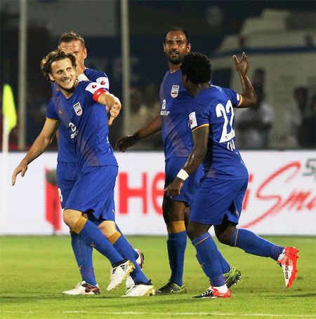 Mumbai City FC's Diego Forlan (left) celebrates with teammates on scoring a hat-trick against Kerala Blasters during their ISL match in Mumbai on Saturday