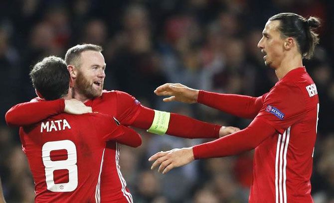 Manchester United's Juan Mata celebrates a goal with Wayne Rooney and Zlatan Ibrahimovic