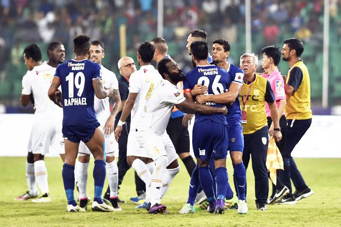 Players of Chennaiyin FC (Blue Jersy) and North East United clash during their Indian Super League (ISL) match at Jawaharlal Nehru Stadium in Chennai on Saturday