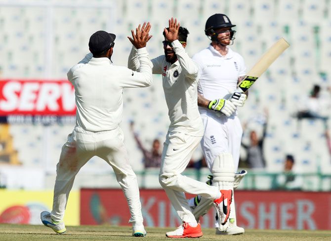 India's captain Virat Kohli and teammate Ravindra Jadeja celebrate the wicket of England's Ben Stokes on Day 1 of the third Test at the Punjab Cricket Association IS Bindra Stadium, in Mohali on Saturday