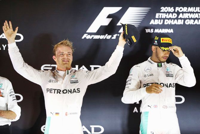 Race winner Lewis Hamilton and second place finisher and Championship winner Nico Rosberg on the podium following the race