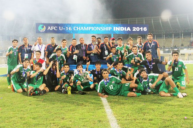 The Iraq team poses with the trophy after winning the AFC U-16 Championships in Margao Goa, on Sunday
