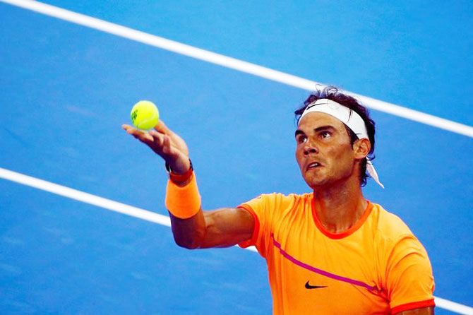Spain's Rafael Nadal serves against Italy's Paolo Lorenzi during the China Open men's singles first round match in Beijing on Tuesday