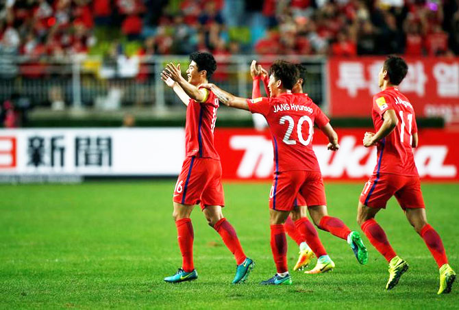 Ki Sung-yueng of South Korea celebrates with his teammates after scoring a goal against Qatar during the World Cup 2018 Qualifier in Suwon, South Korea, on Thursday