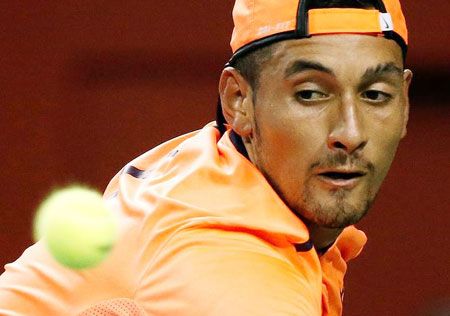 Australia's Nick Kyrgios returns the ball during the semi-final against France's Gael Monfils at the Japan Open on Saturday