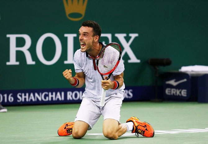 Bautista Agut reacts after defeating Novak Djokovic and entering the Shanghai Masters final on Saturday