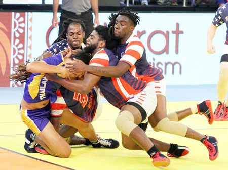 Player of USA kabbadi team catch a raider from Thailand during the Kabaddi World Cup 2016 match in Ahmedabad on Sunday