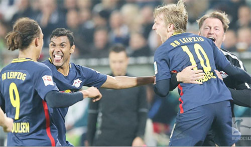 RB Leipzig players celebrate a goal against Hamburg during their Bundesliga match on Sunday