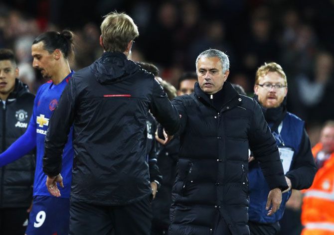 Liverpool manager Juergen Klopp and Manchester United manager Jose Mourinho at the end of the match on Monday