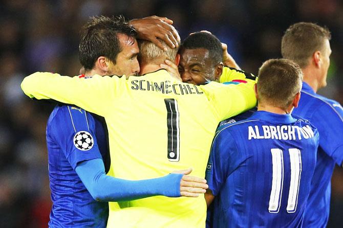 Leicester City's Kasper Schmeichel celebrates with Christian Fuchs and Wes Morgan after the game against FC Copenhagen at King Power Stadium in Leicester on Tuesday