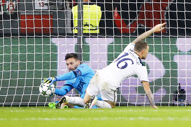 Tottenham's Hugo Lloris makes a save from Bayer Leverkusen's Javier Hernandez (not pictured)