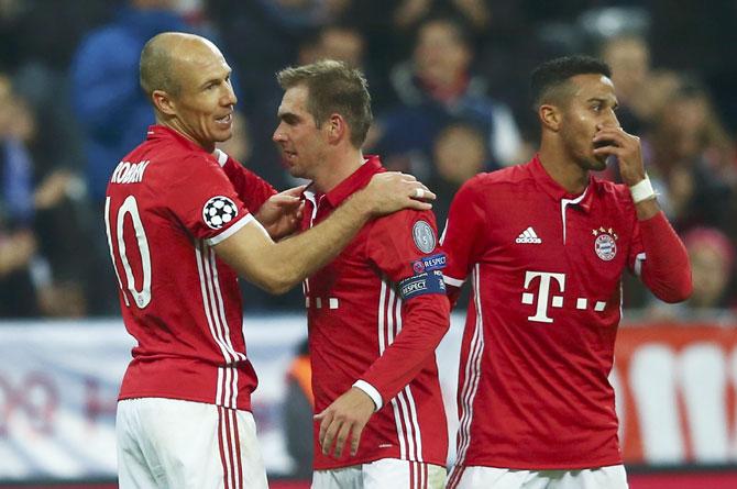 Bayern Munich's Arjen Robben celebrates his goal against PSV Eindhoven with Phillip Lahm and Thiago Alcantara at Allianz Arena, Munich, on Wednesday