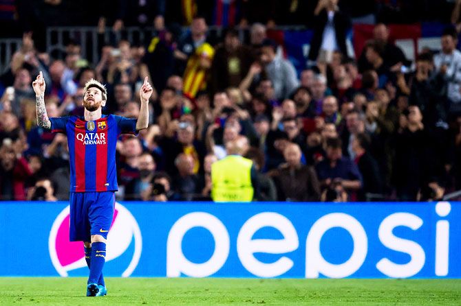 FC Barcelona's Lionel Messi celebrates after scoring his team's second goal during the UEFA Champions League group C match against Manchester City FC at Camp Nou on Wednesday