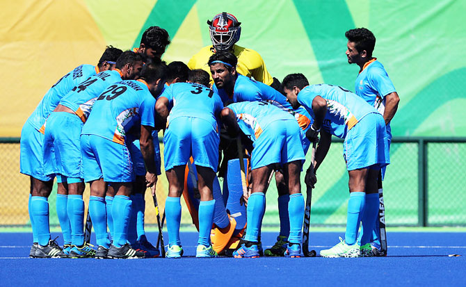The Indian hockey team in a huddle