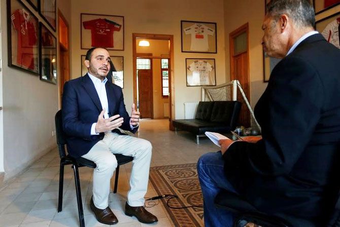 Jordan's Prince Ali Bin Al Hussein (left), president of the Jordanian Football Association, speaks with Reuters journalist Suleiman al-Khalidi during an interview, in Amman, Jordan