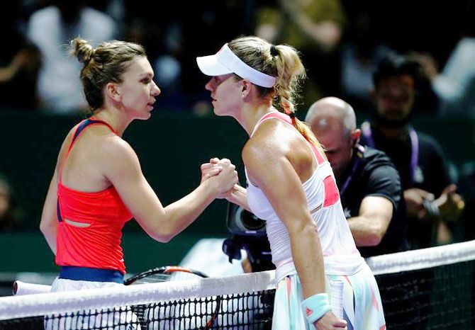 Angelique Kerber is congratulated by Simona Halep after the match 