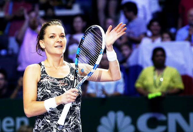 Agnieszka Radwanska of Poland celebrates after defeating Karolina Pliskova of the Czech Republic 