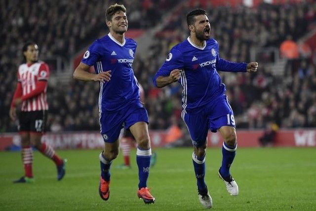 Chelsea's Diego Costa celebrates scoring their second goal with Victor Moses and teammates