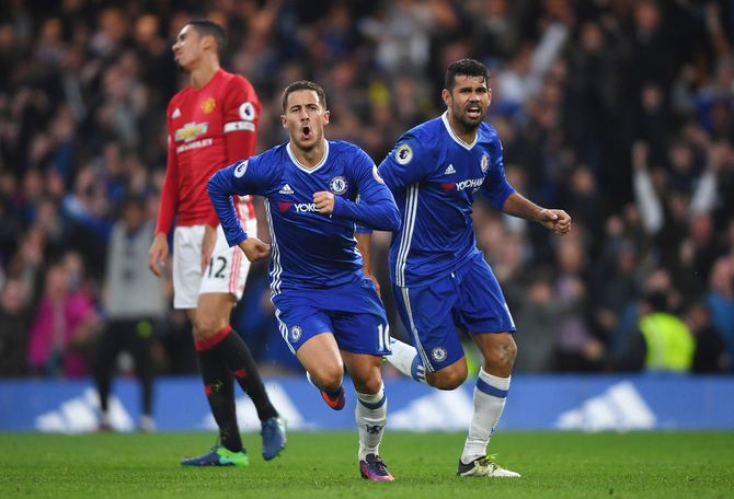 Chelsea's Eden Hazard celebrates scoring his sides third goal with teammate Diego Costa