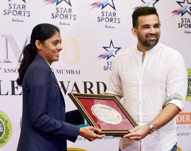 Steeplechase specialist Lalita Babar is felicitated by criketer Zaheer Khan during the Sports Journalists Association of Mumbai’s (SJAM) Golden Jubilee Annual Awards 2016, in Mumbai on Saturday