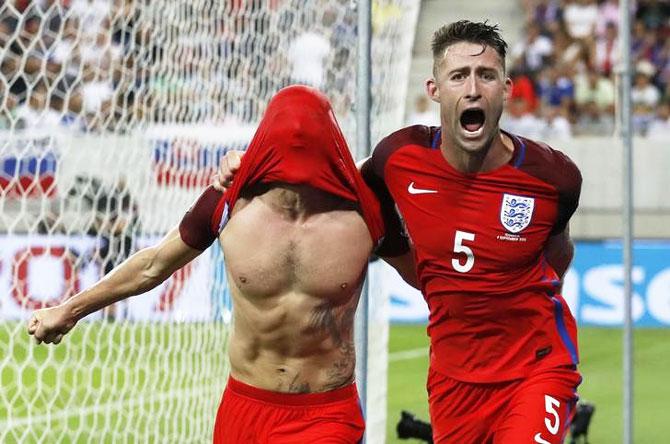 England's Adam Lallana (left) celebrates scoring the winning goal with teammate Gary Cahill