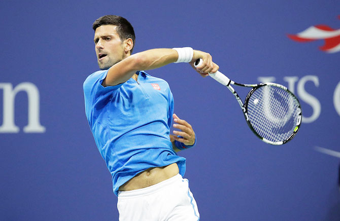 Novak Djokovic of Serbia hits a return in his match against Kyle Edmund of Great Britain during their fourth round match on Sunday