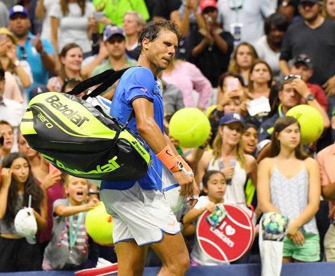 Spain's Rafael Nadal leaves the court after losing to France's Lucas Pouille on Sunday