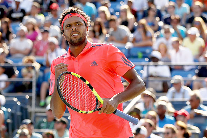 Jo-Wilfried Tsonga of France reacts against Jack Sock of the United States 
