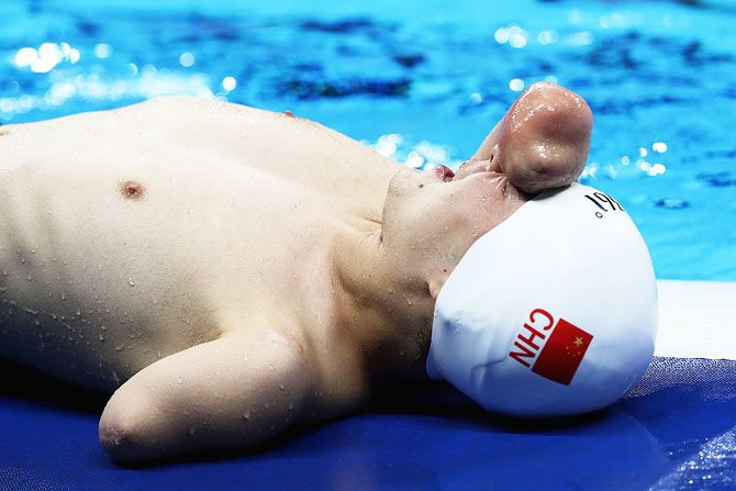Jia Hongguang of China reacts after winning the gold medal in the Men's 50m Freestyle - S6 Final at the Olympic Aquatic Stadium on Saturday, September 10