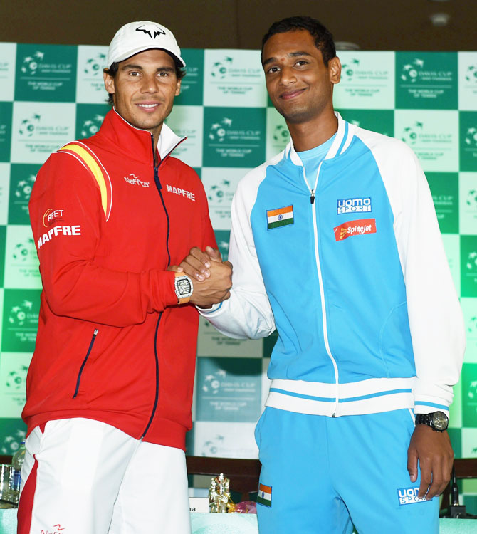 Spanish tennis player Rafael Nadal with India's Ramkumar Ramanathan during the draw ceremony of the World Group Play off tie for the Davis Cup, in New Delhi on Thursday