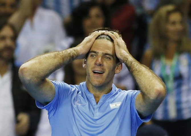 Argentina's Juan Martin del Potro celebrates after winning his Davis Cup semi-final match against Great Britain's Andy Murray in Glasgow on Friday