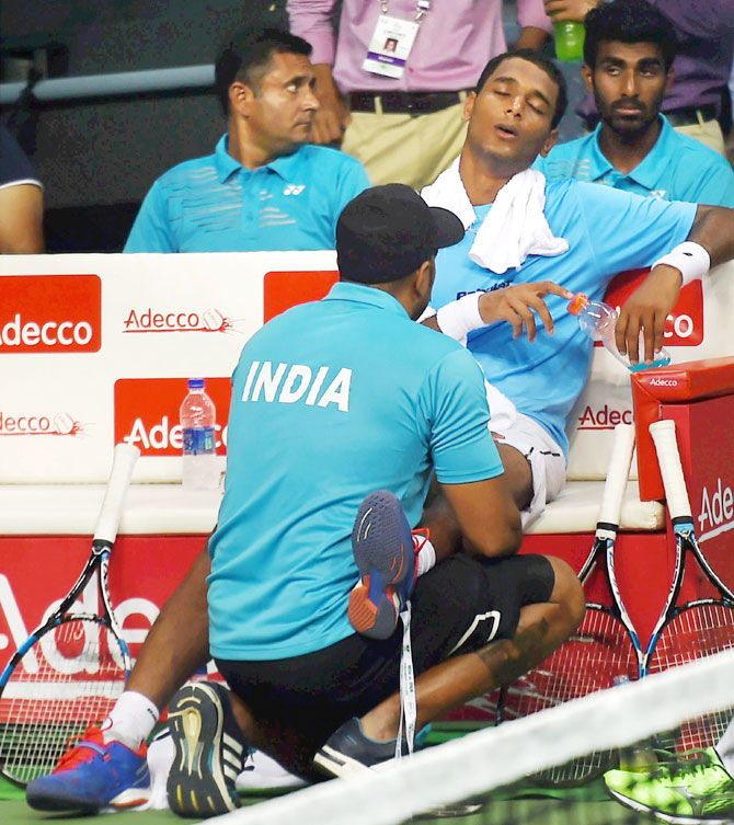 India's Ramkumar Ramanathan receiving medical treatment as he plays against Spains Feliciano Lopez during the Davis Cup World Group Play-off match, in New Delhi on Friday