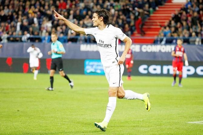 Paris Saint Germaine's Edinson Cavani celebrates a goal against Caen during their French Ligue 1 match at the Michel d'Ornano stadium in Caen, France, on Friday