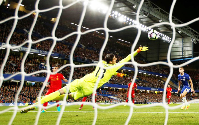 Liverpool's Dejan Lovren scores their first goal