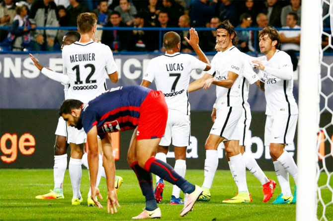 Paris Saint Germaine's Edison Cavani celebrates his goal with teammates during their Ligue 1 match on Tuesday