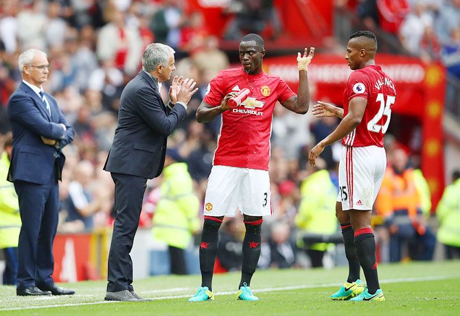 Jose Mourinho, Manager of Manchester United gives Eric Bailly of Manchester United and Antonio Valencia of Manchester United instructions 