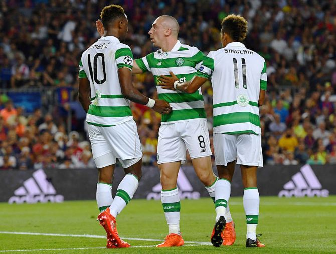Celtic's Moussa Dembele with teammates Scott Brown and Scott Sinclair