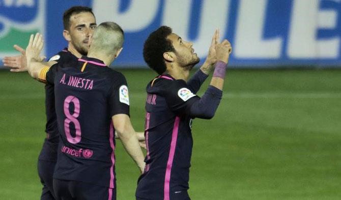 Neymar celebrates on scoring his 100th goal Barcelona goal during their La Liga match against Granada on Sunday