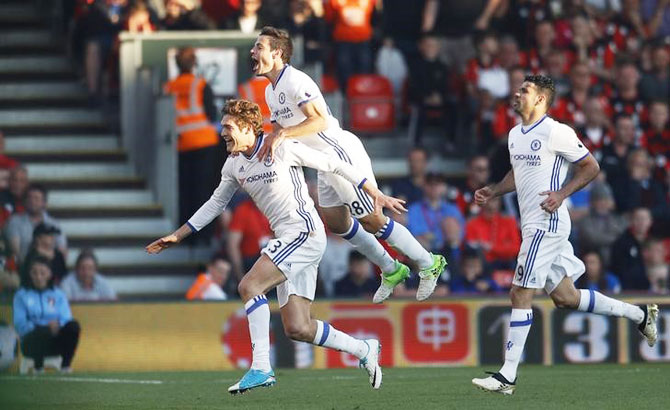 Chelsea's Marcos Alonso celebrates scoring their third goal with Cesar Azpilicueta and Diego Costa during their English Premier League against AFC Bournemouth at Vitality Stadium in Bournemouth on Saturday