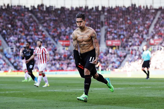 Liverpool's Roberto Firmino celebrates scoring their second goal against Stoke City on Saturday