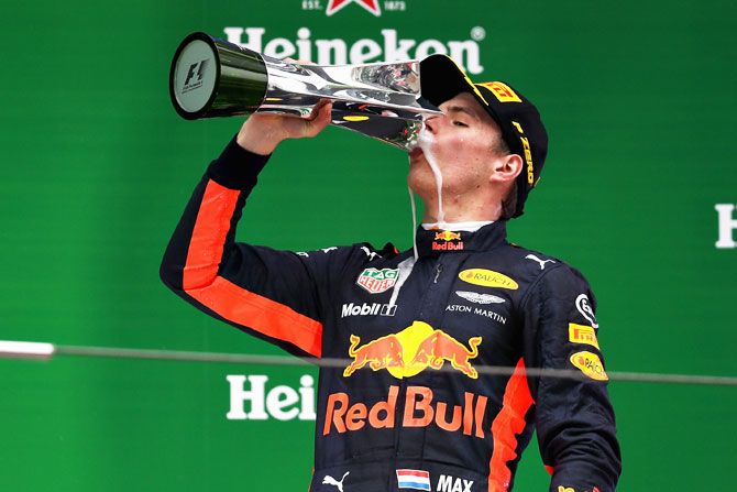 Max Verstappen of Netherlands and Red Bull Racing celebrates his third place finish on the podium on Sunday