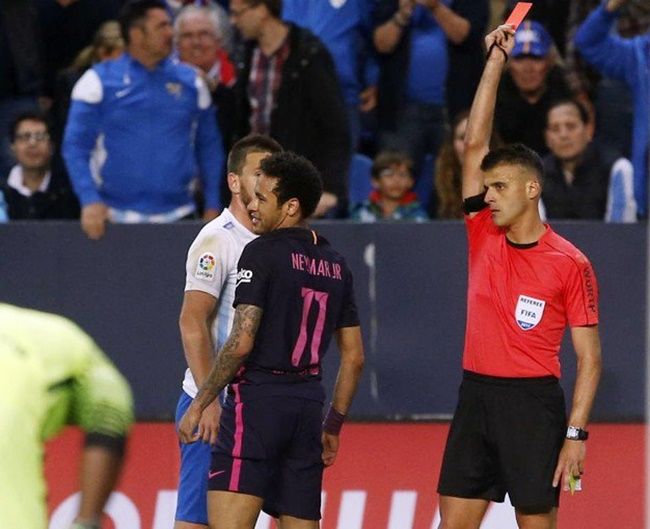 Barcelona’s Neymar is given marching orders by referee Jesus Gil Manzano during the La Liga match against Malaga on Saturday